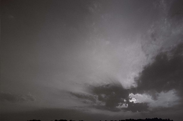 ohio black and white sun behind clouds bottom right. 