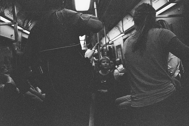 NYC 2009 underground transit number one with child talking to woman. 