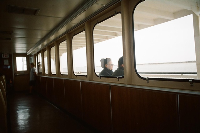 opposing gazes exterior and interior of ferry. 