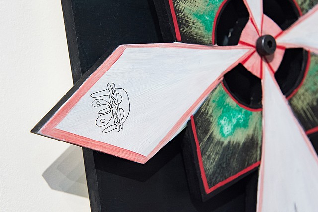 Kinetic sculpture spins by way of human interaction, painted in oil and drawn on