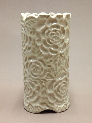 white stoneware vase with clear glaze and carved intaglio surface decoration