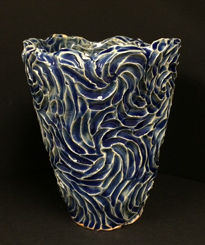 stoneware vase with deep blue glaze and intaglio surface texture