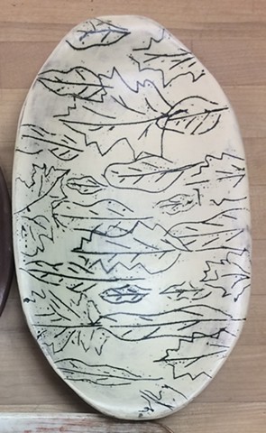 slab formed platter with glaze, slip and inlay decoration