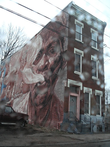 philadelphia city street mural through a rain drop window