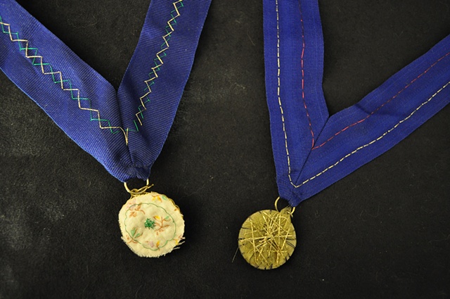 Kickstarter rewards: Button medals (back)