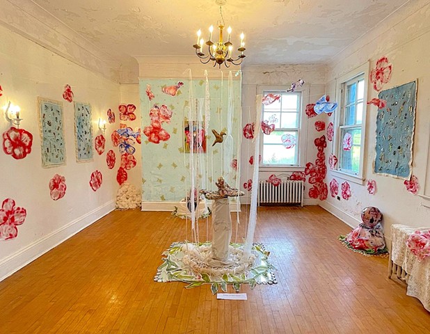 Birth and Loss Ritual Healing, 2023 Multi-Media Installation Ribbons, rope, string, yarn, fabric, acrylic on tracing paper, acrylic on canvas, silkscreen on canvas, ink jet prints, linocut prints on painted paper, plaster sculpture, beads, rhinestones, gl