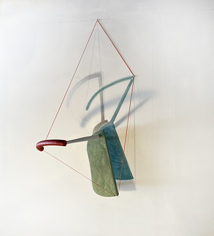 This is an abstract sculpture made of a reconfigured found chair, graphite and chalk wall drawing