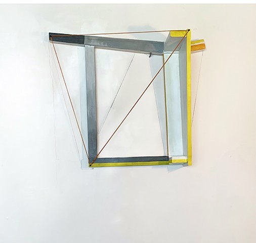 This is a sculpture made from a reconfigured found chair and wall drawing of cast shadows and negative spaces by Sheila Ghidini.
