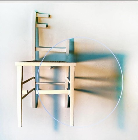 Wall sculpture with wall drawing of cast shadows in graphite and chalk.