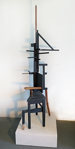 Sentry, one of three sculptures constructed of reconfigured found wood chairs