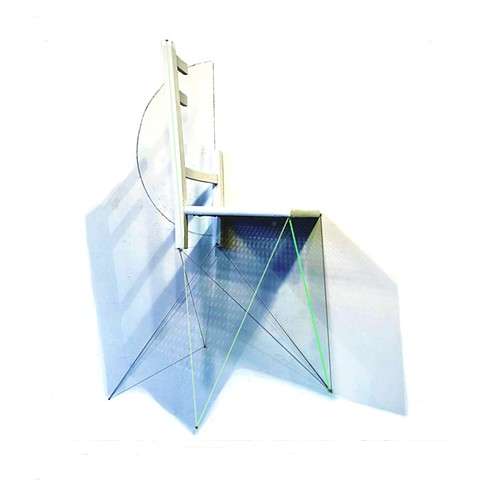 This is a wall sculpture, constructed with a reconfigured found wood chair and drawing directly on the wall with graphite and chalk of real and imaginary cast shadows.