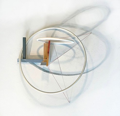 This is a mixed-media sculpture, a reconfigured found chair and rings with a drawing of cast shadow on the wall, thread + map pins, pastel and graphite drawing, 2021