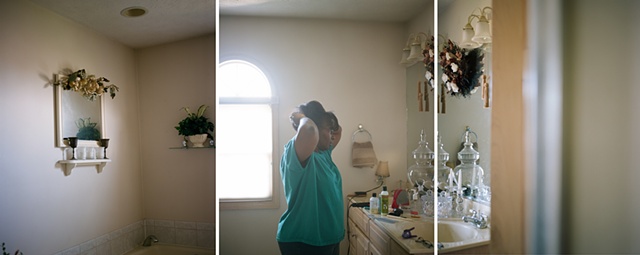 Mom in bathroom fixing her hair