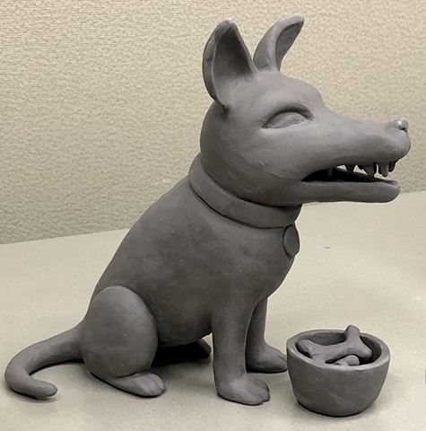 Working on little ceramic dog figures.