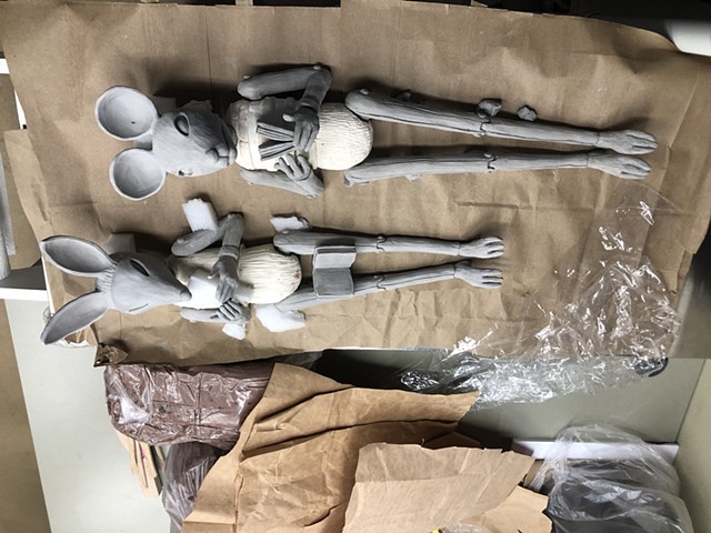 Clay wall art being propped into position for drying. 