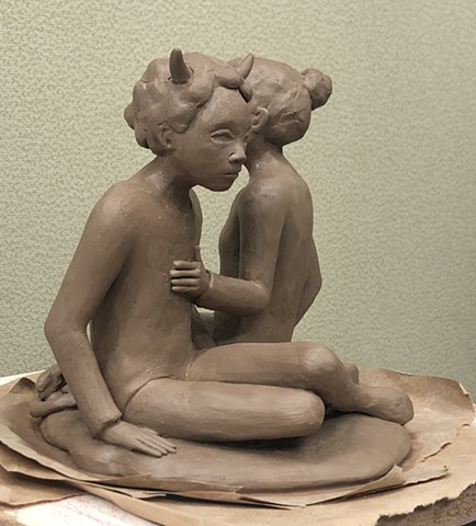 Building figures in clay. 