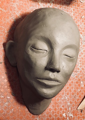Clay wall faces being sculpted in cone 6 hand building clay. My goal is to make 100 individual clay wall faces by the new year.  