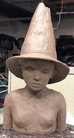 Building clay Witch figure.