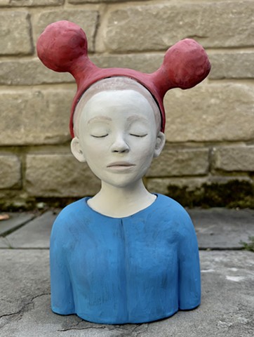 Figure with unusual hat.