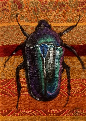 scarab beetles have been portrayed since ancient Egypt as a symbols of good luck