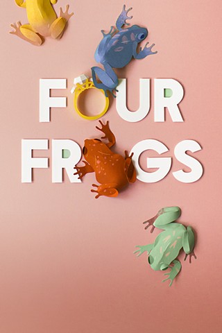 Paper frogs hop around the words "Four Frogs" and a large engagement ring.