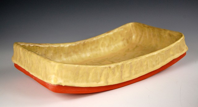 yellow curved dish