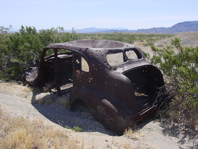 Odd inspiration, but I love any kind of metal!
Our RV broke down in Needles, CA.  The nice tow truck driver took us off-roading in his jeep.  He showed us old, forgotten parts of RT. 66.  We came across this old car in the middle of the desert.
