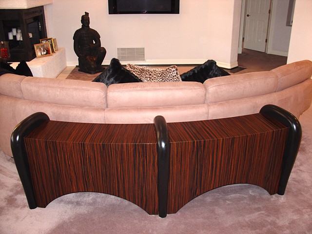 Curved sofa back table
