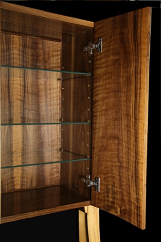 Interior view of walnut cabinet.