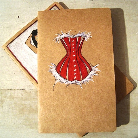 Original art by British Contemporary artist, Linda Boucher. This beautiful Moleskine notebook features Mrs Claus' red silk corset, with white fur trim. A great assest in the run up to the big day.