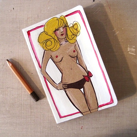 A Blonde Pin Up on the cover of a Moleskine Notebook, hand illustrated by Linda Boucher.