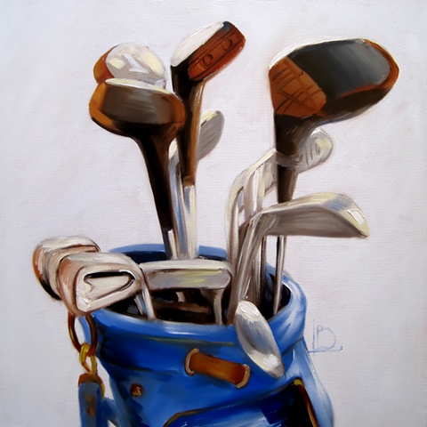 A still life oil painting of a set of golf clubs in a blue golf bag, by Brighton Artist Linda Boucher