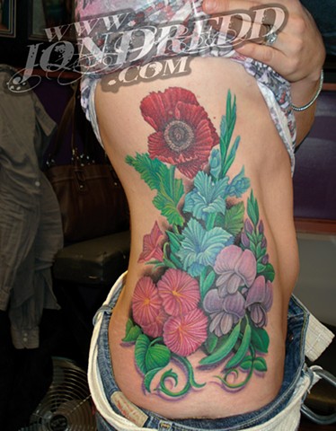 crucial tattoo studio salisbury maryland tattoos jonathan kellogg jon dredd sweet pea flowers bouquet ribs hip tattoo delaware ocean city