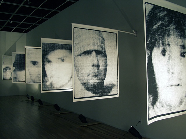 Archival Pigment Prints on Tyvek Banner Paper hung on a PVC poles and plastic flag pole holders.