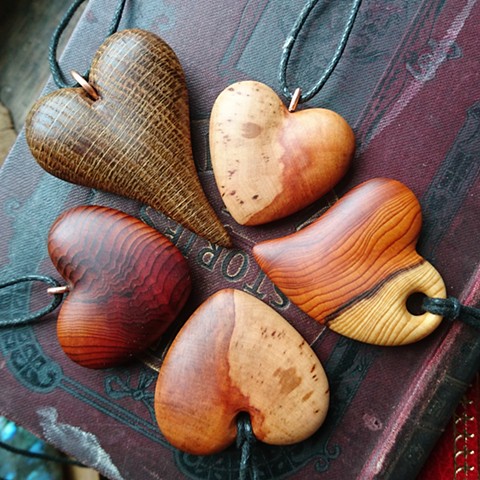 Heart pendants, yew, oak and hawthorn