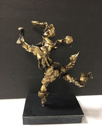 Bronze sculpture of dog blissfully running