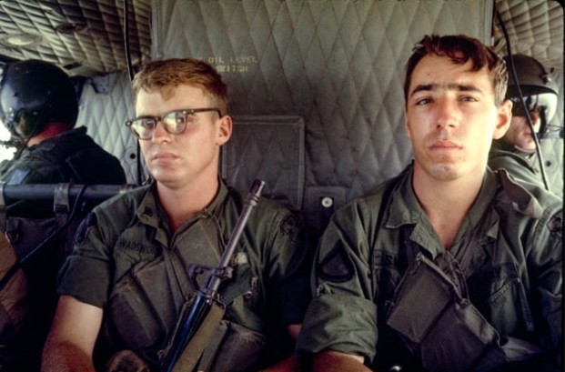 Two American Soldiers in a helicopter. 1969
