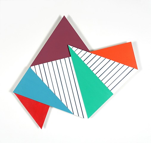 Abstract 2-d wall sculpture constructed of colorful angular shapes