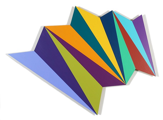 Abstract irregularly shaped piece painted with 12 differently colored triangles