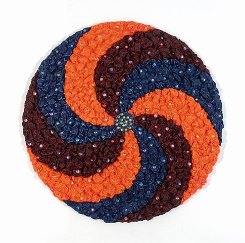 Wall sculpture in spiral design with plastic gems 