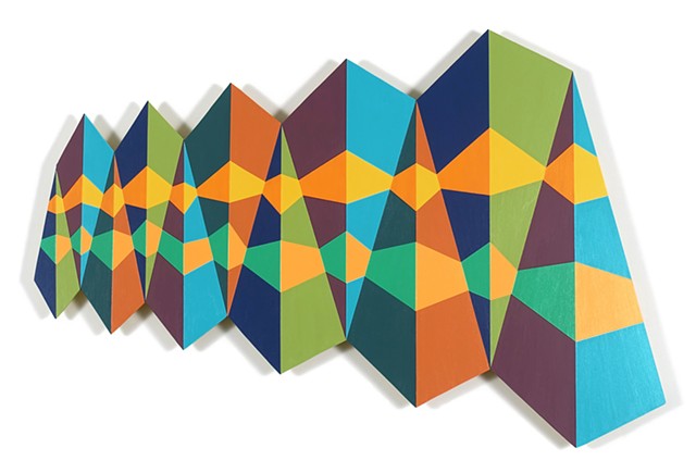 row of colorful triangles intersected by two irregular patterns on shaped panel