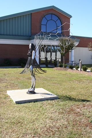 The sculpture represents how guardian angels can exist on this earth.