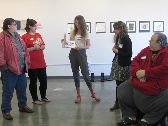 CultureWorks students present their book project to their Greenbriar neighbor.