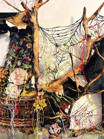 Basket of flowers with branches and spiderwebs (Unravel)