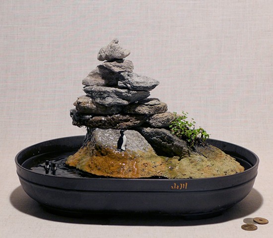 tabletop fountain with handmade miniatures, pump, and live plant
