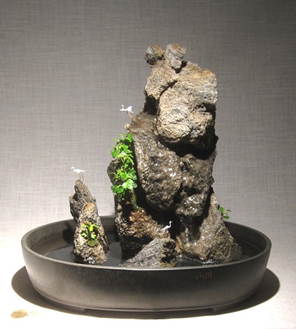feather rock cairns with waterfall, ivy, and miniature birds