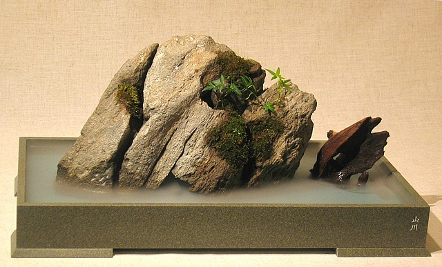 zen indoor fountain rock sculpture with plant and fogger