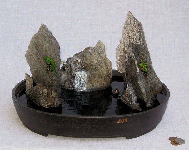 tabletop fountain with feather rock islands and miniature boat
