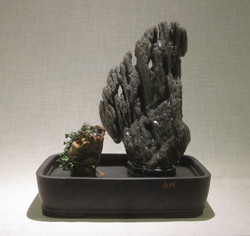 scholar's rock on daiza with driftwood