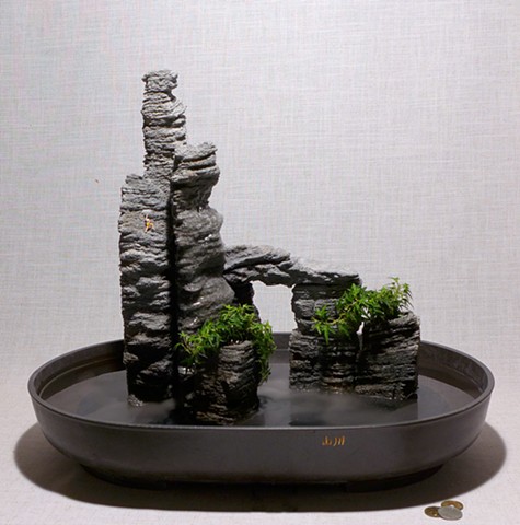 eroded feather rock towers with fogger, waterfall, ivy, miniature climber